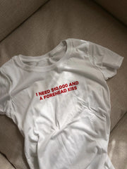 I Need $10,000 and a Forehead Kiss” Baby Tee – Trendy Statement Color White