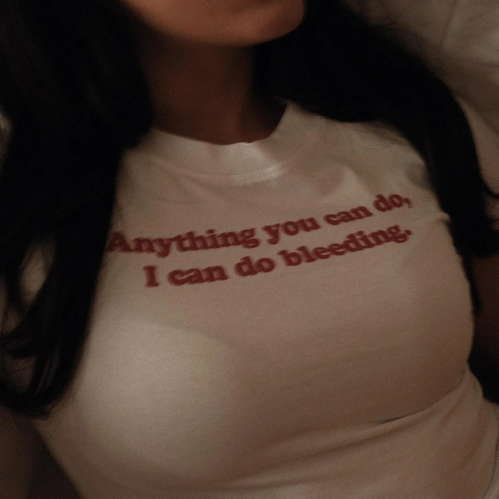Anything You Can Do, I Can Do Bleeding” Baby Tee – Color White